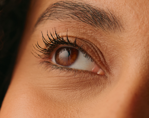 The fine, crepey skin of the eyelid seen in close detail